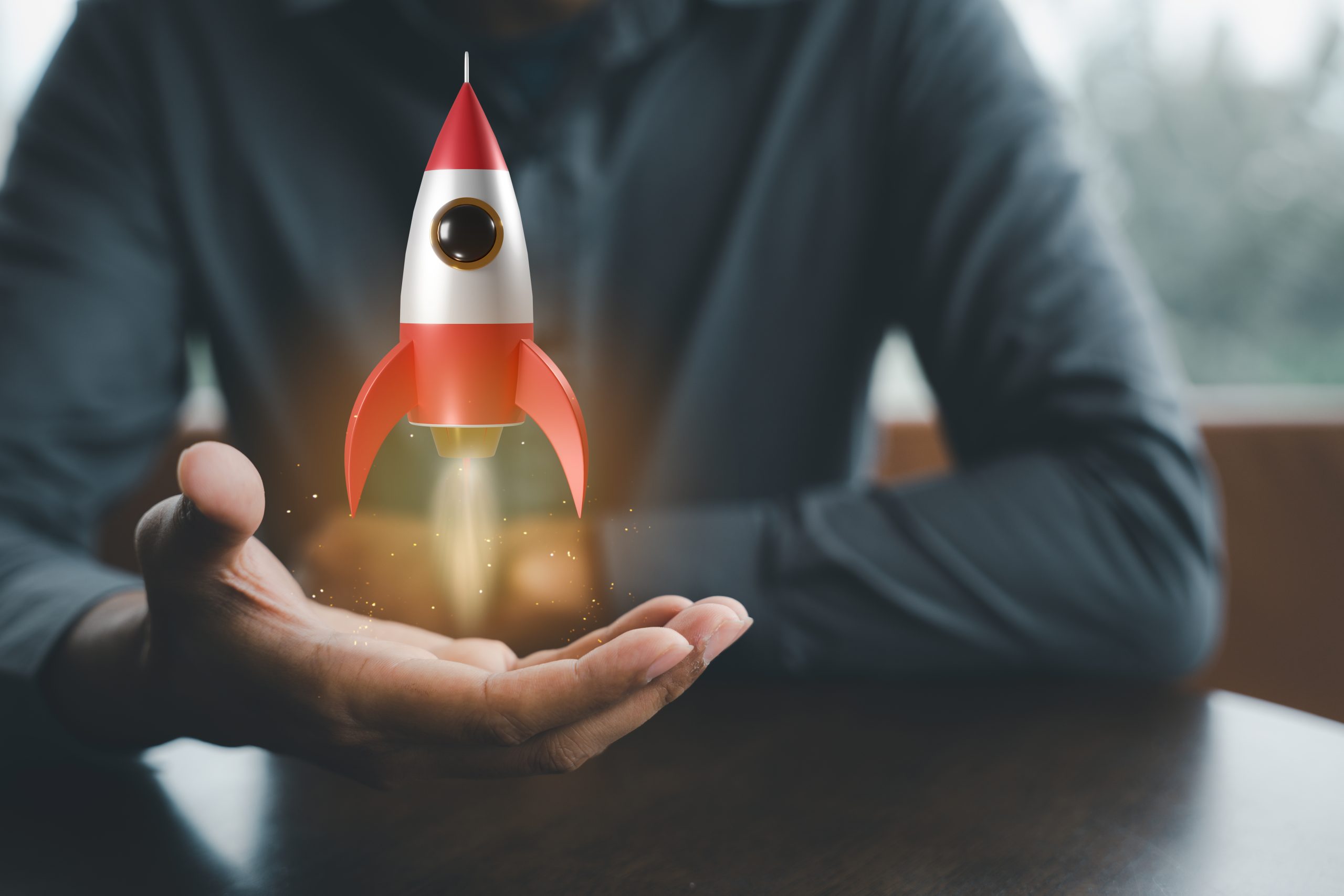 Businessman holding a rocket