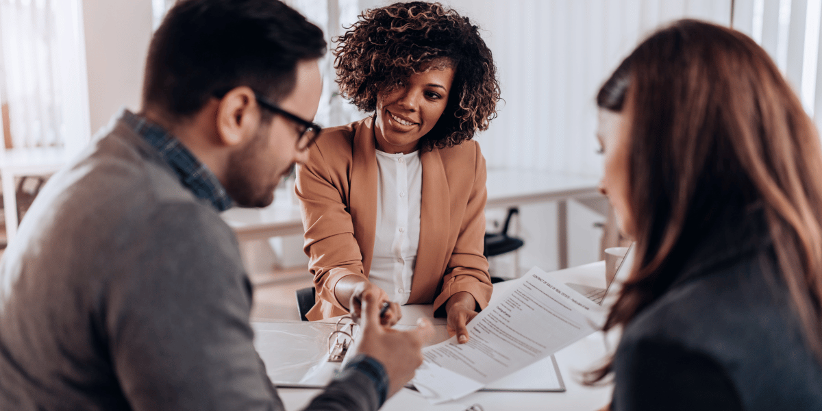 couple getting a loan from a bank officer